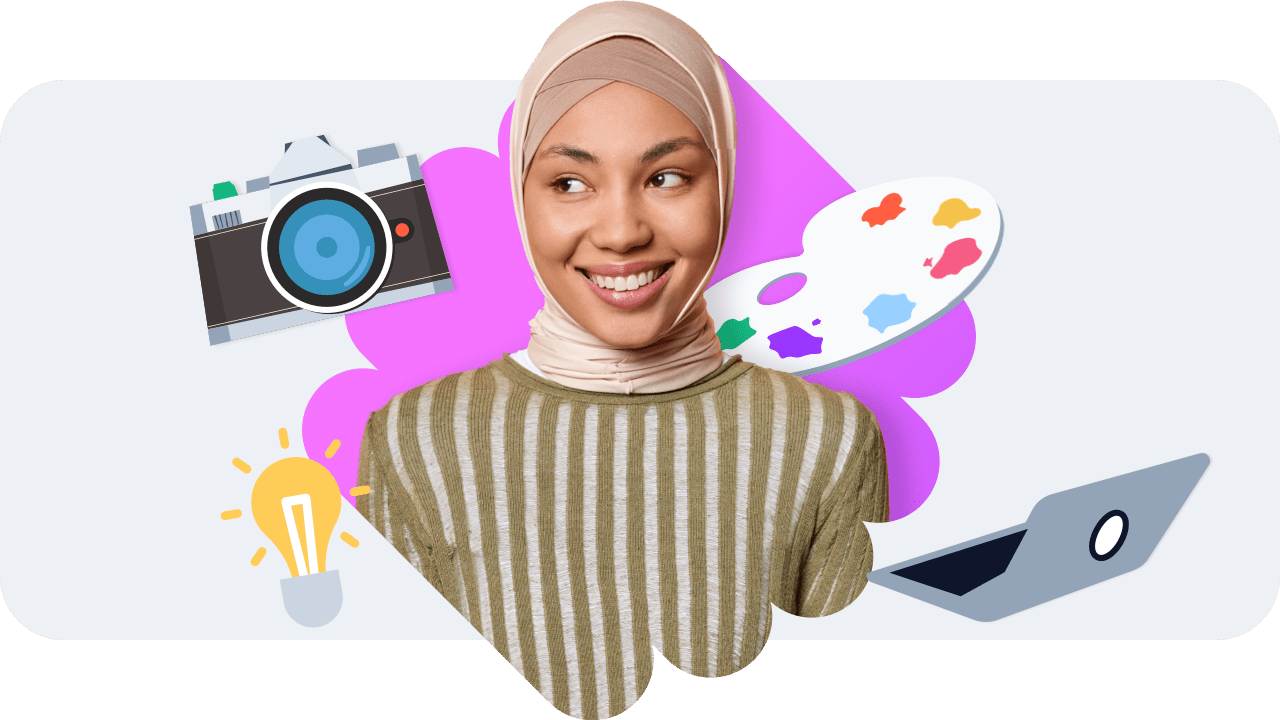 An artist smiling, they are wearing a striped jumper and a hijab